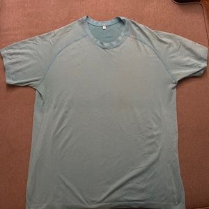 Lululemon Turquoise “The more you sweat, the better you look naked” T-Shirt.